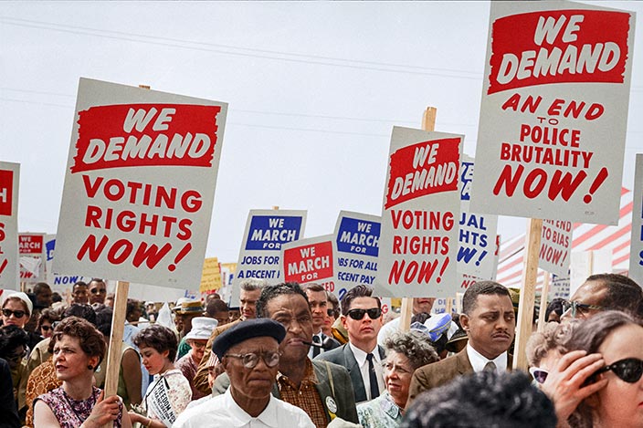 Marchers holding signs at the March on Washington in 1963. Unseen Histories / Unsplash.com.